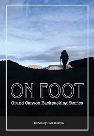 Cover a book titled “On Foot: Grand Canyon Backpacking Stories”. Open sky, silhouette of a backpacker with Grand Canyon in the distance.